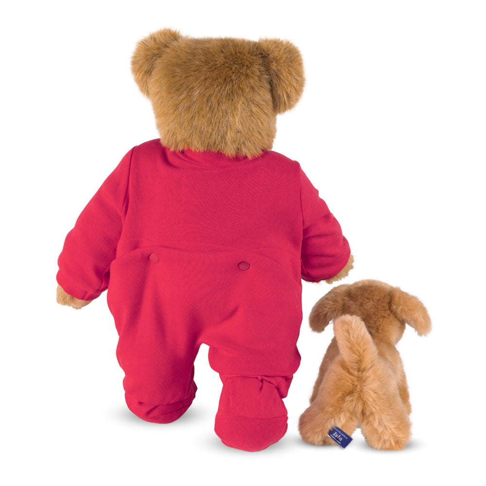 Honey-colored teddy bear in red pajamas with a small brown puppy plush, both facing away.
