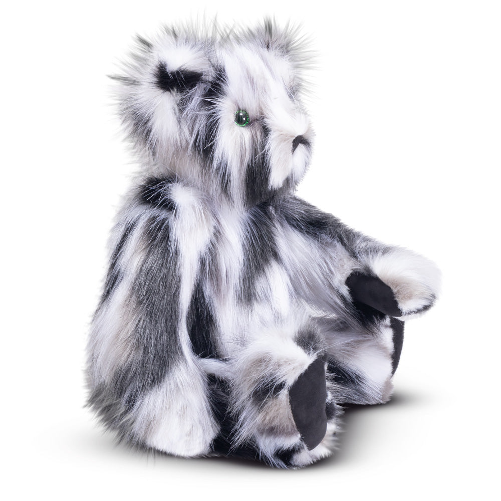 20-inch plush bear with soft black-and-white fur, green eyes, and black paw pads sitting upright.