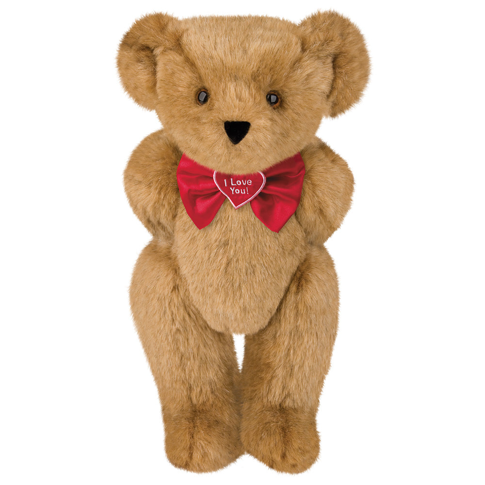 Light brown plush teddy bear with black eyes and nose wearing a red bow tie embroidered with "I Love You".