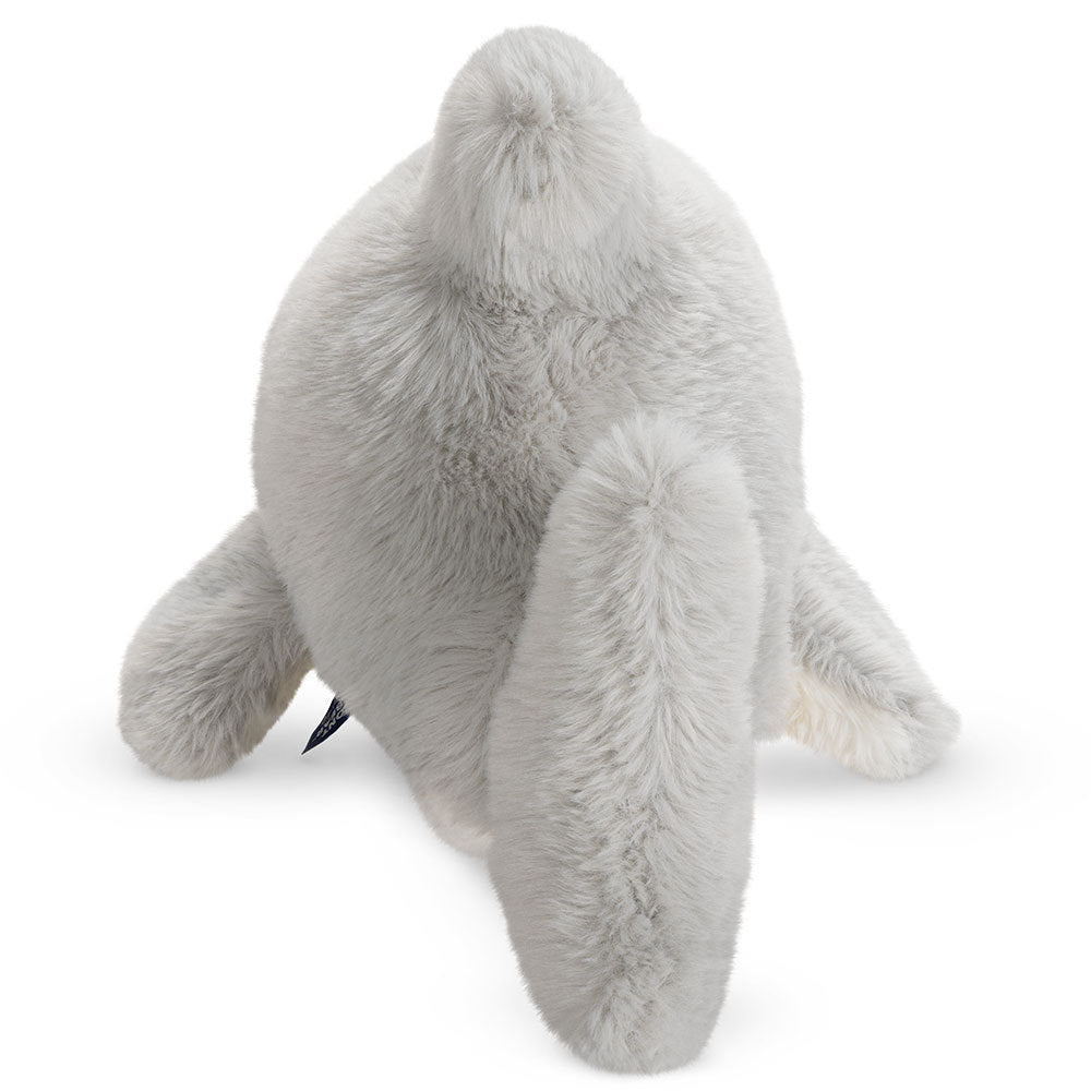 Plush light gray shark toy with soft textured fabric and rounded fins, facing away.