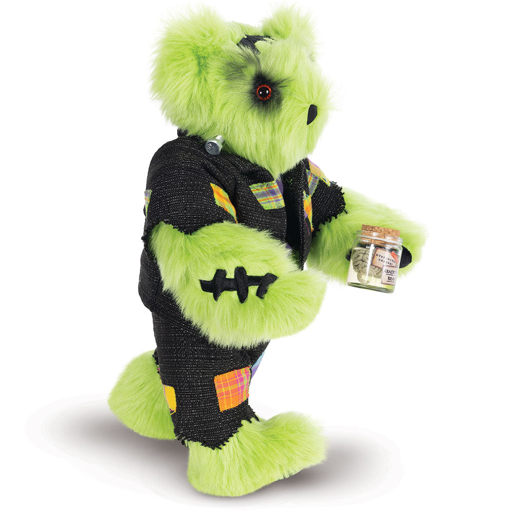 15-inch bright green plush bear dressed as Frankenstein with stitched patchwork outfit holding a small jar.