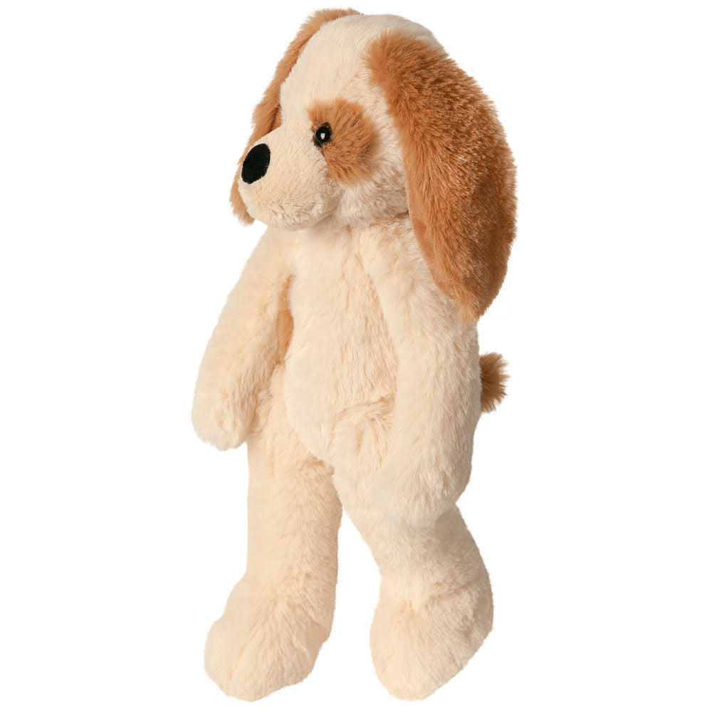 Plush light brown and cream puppy with long floppy ears, standing upright.