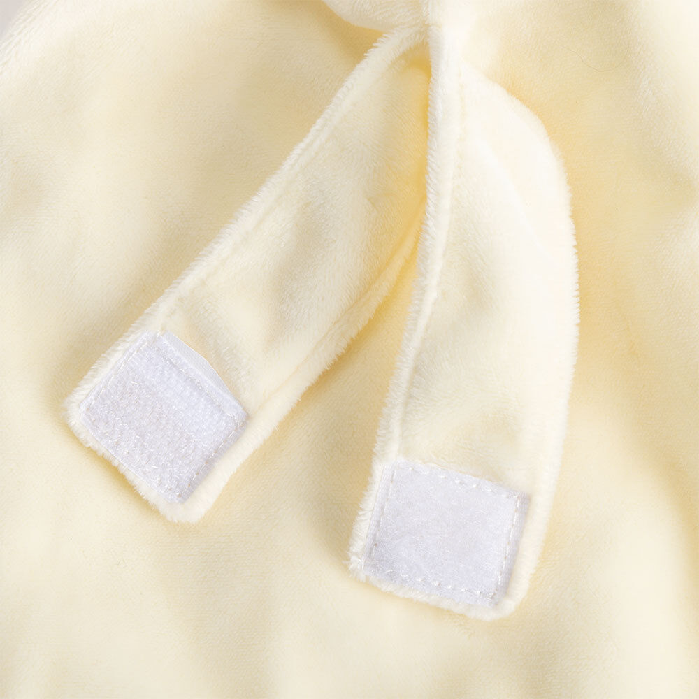 Cream-colored soft fabric with two plush bear paws featuring white hook-and-loop patches.