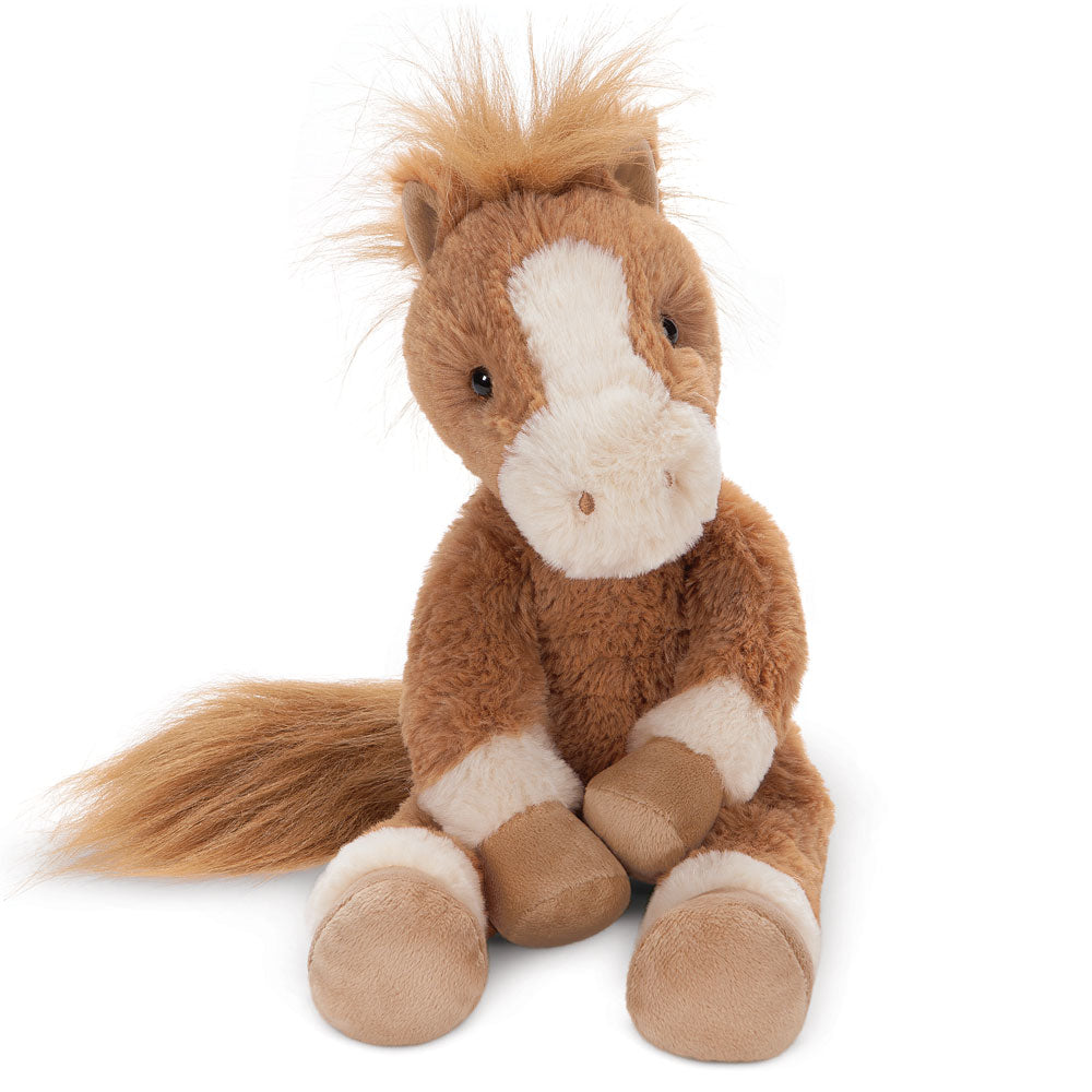 Brown and white plush pony with fluffy mane and tail sitting upright.