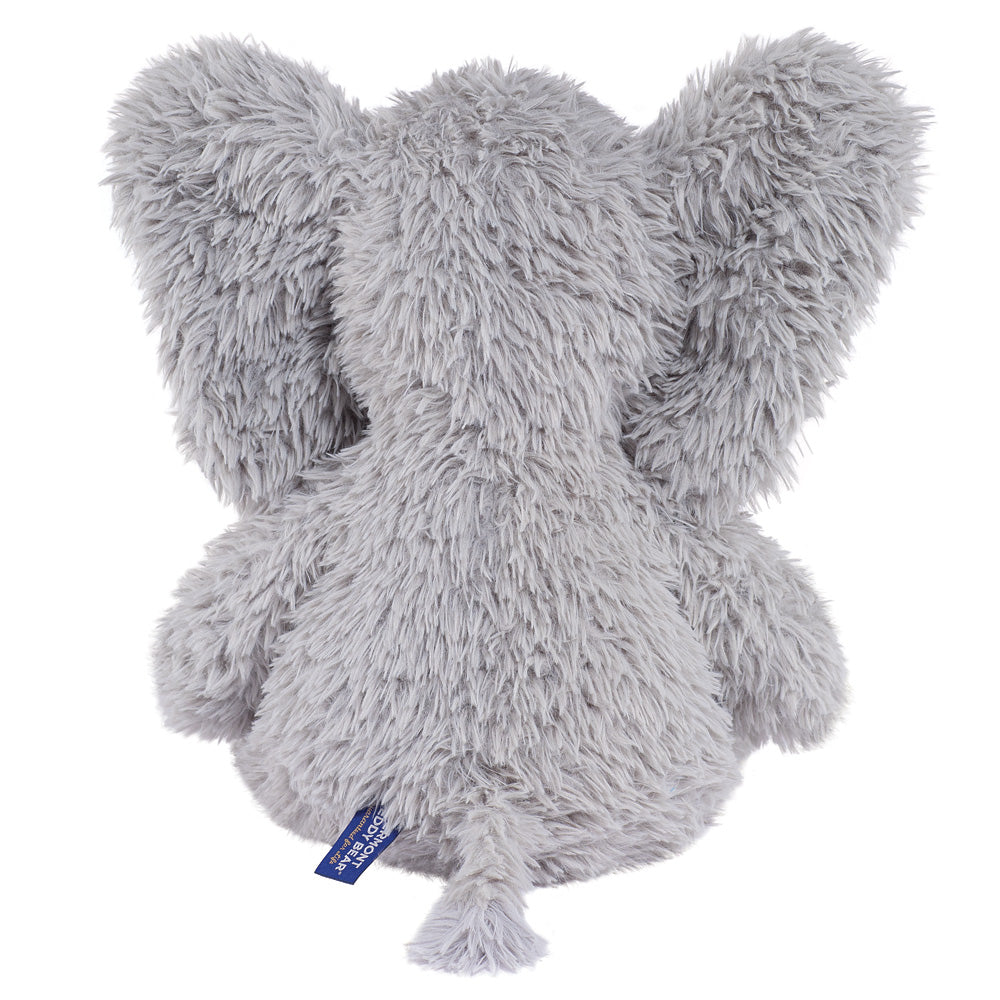 Soft gray plush elephant with large ears and a small tail on a fuzzy texture.