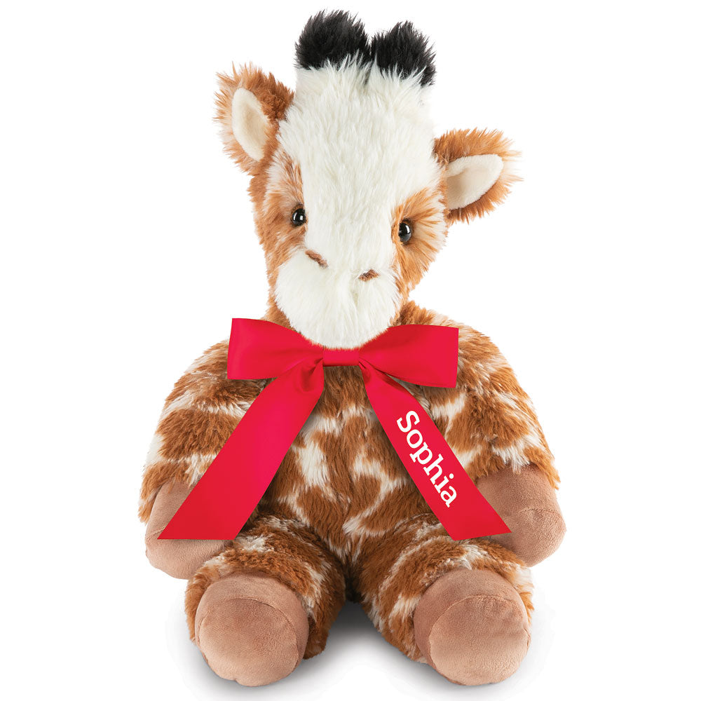 Plush giraffe with soft brown and white fur, black-tipped ears, and red bow with "Sophia" text.