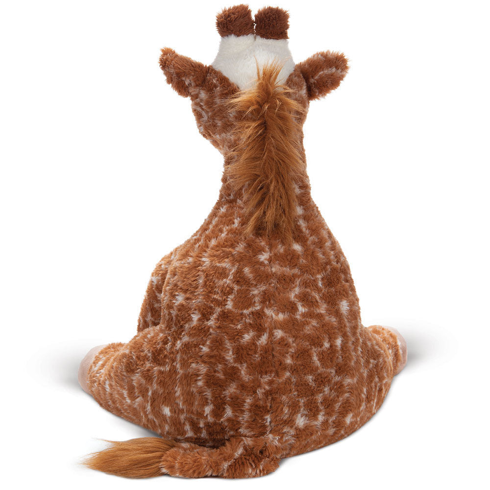 Plush giraffe toy with brown and white spotted fur, viewed from behind sitting upright.