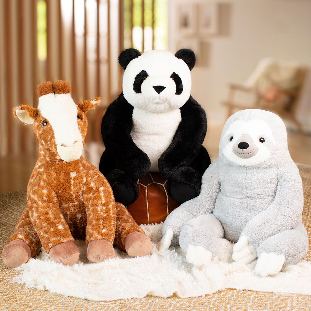 3 1/2 ft plush gentle giant panda with black and white fur sitting upright.
