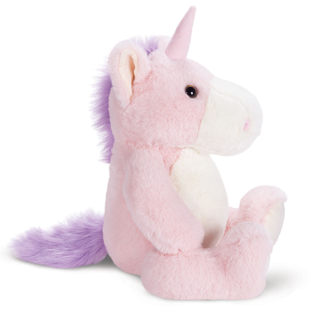 Plush pink unicorn with purple mane and tail, white snout, sitting upright, soft and cuddly design.