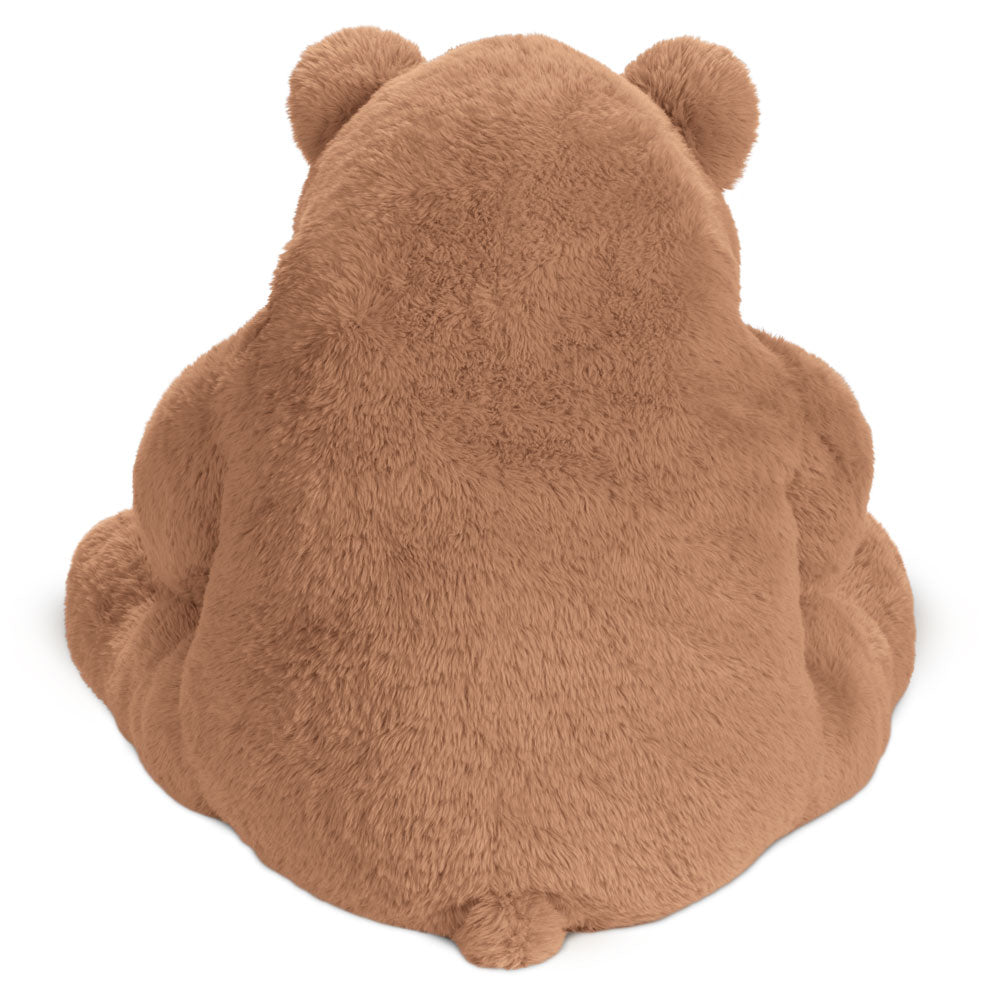 Plush light brown bear toy sitting facing away with rounded ears and small tail.