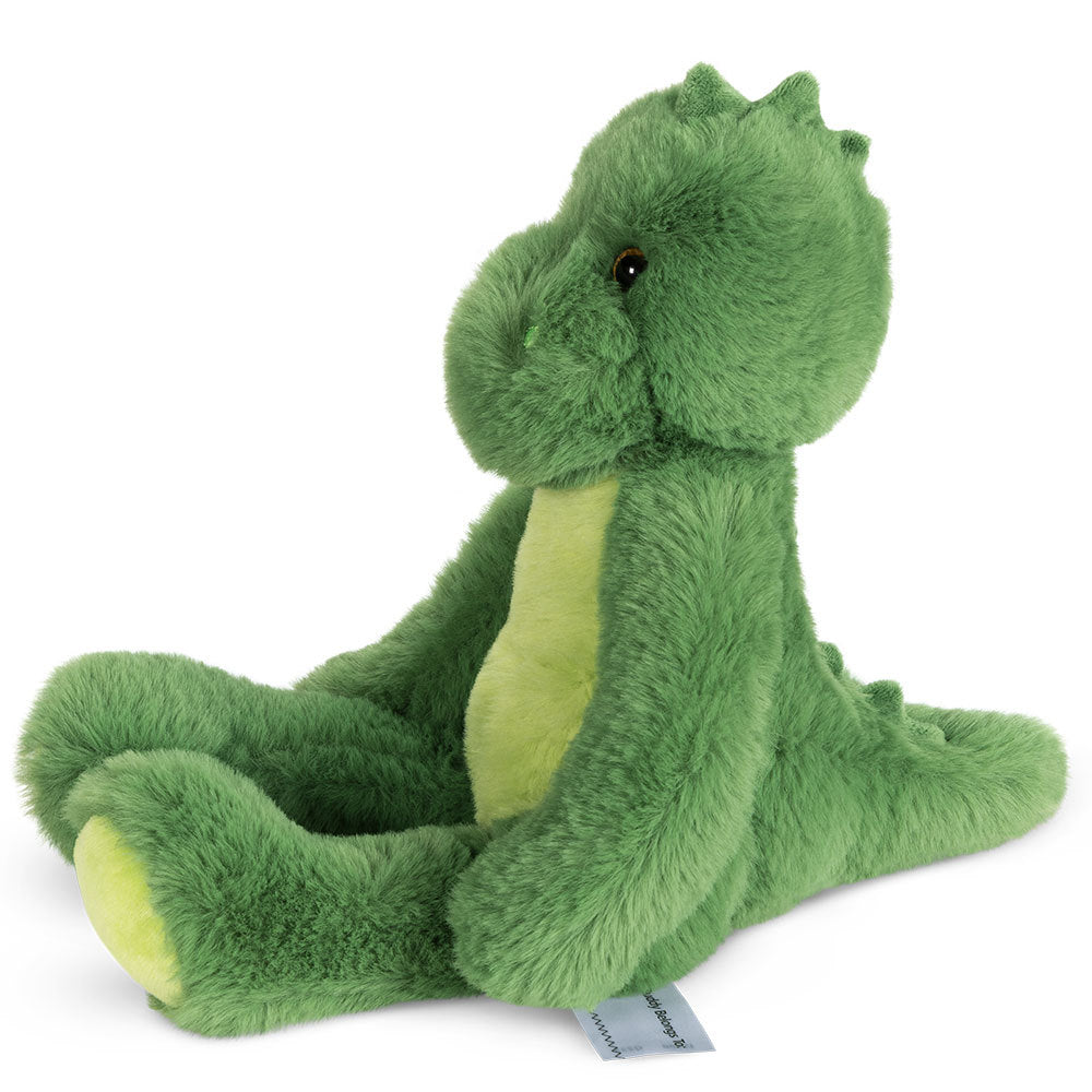 Green plush dinosaur toy with light yellow belly, sitting upright, soft textured fur.