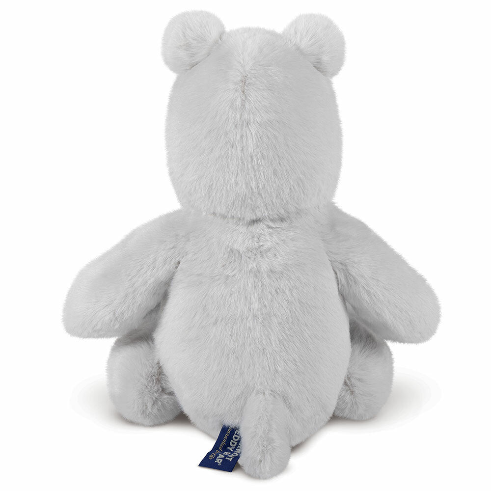 Gray plush hippo sitting with back facing forward, soft fuzzy texture, small tail visible.