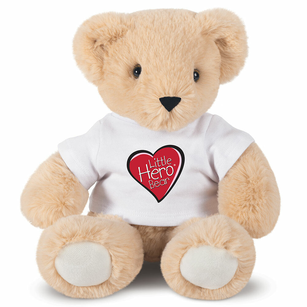 Light brown plush teddy bear wearing white t-shirt with red heart and "Little Hero" text.