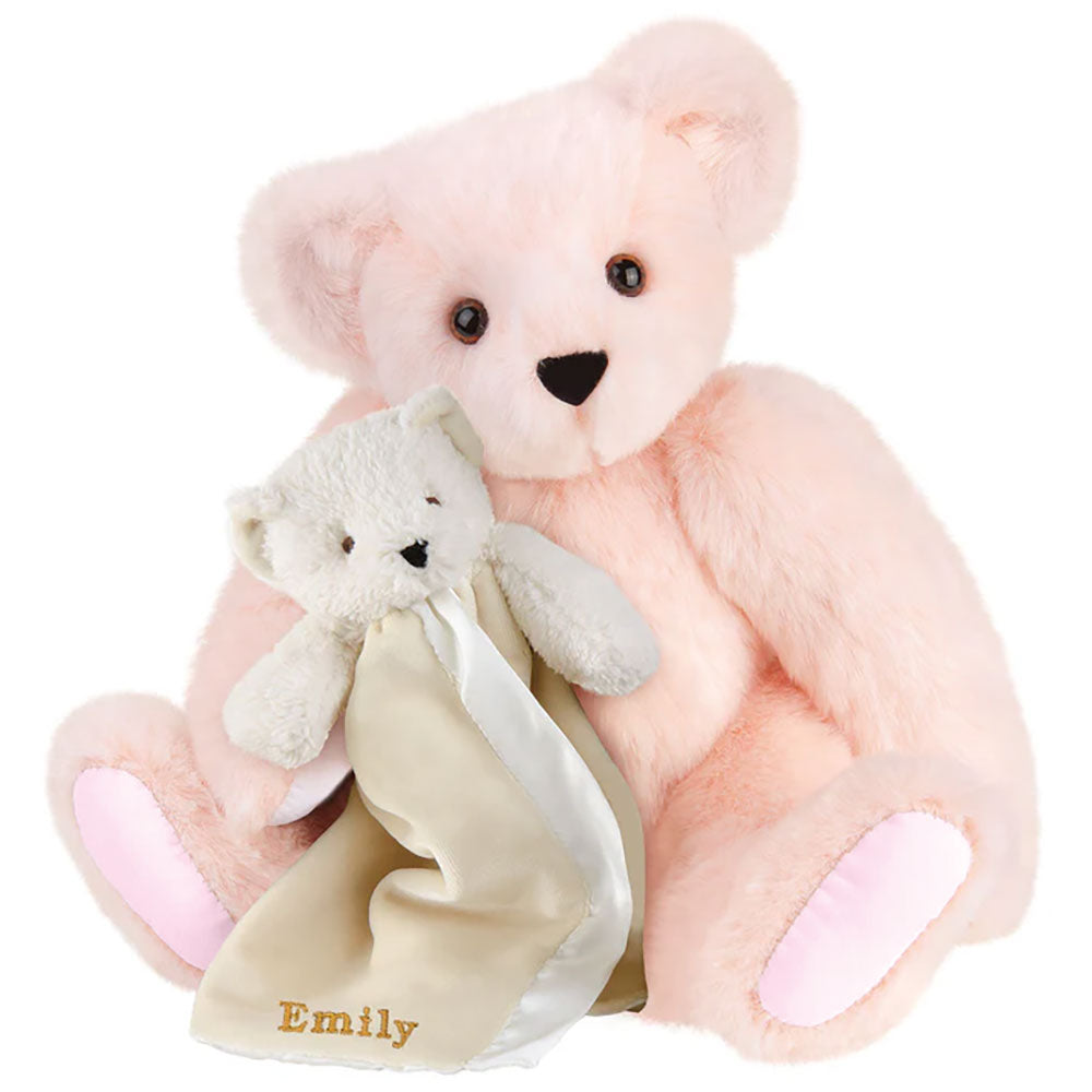 Soft bubblegum pink teddy bear with light pink paw pads holding a cream-colored bear blanket embroidered with "Emily" in.