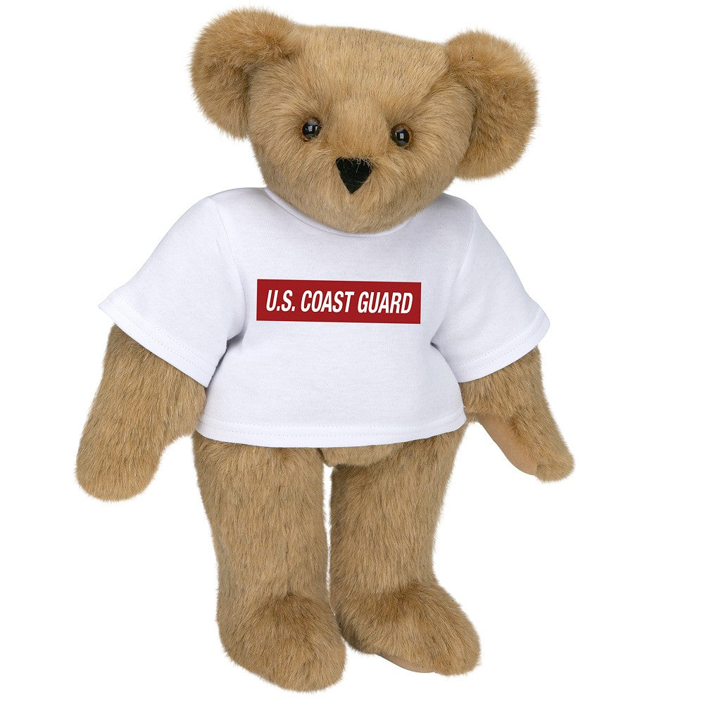Light brown plush teddy bear wearing a white U.S. Coast Guard t-shirt with brown eyes.