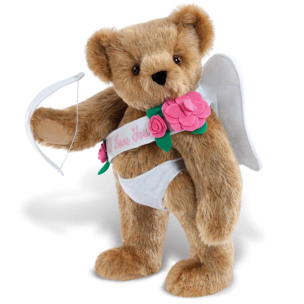 Brown teddy bear wearing white angel wings, white underwear, pink flower sash, and holding a white bow with arrow.