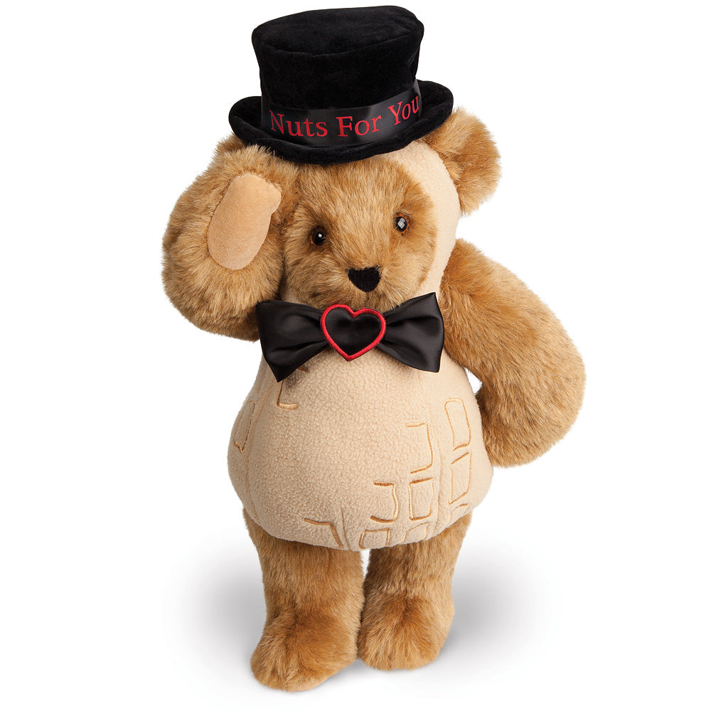Brown plush bear with tan snout and belly, wearing a black hat embroidered with "Nuts For You" and a black bow tie with a.