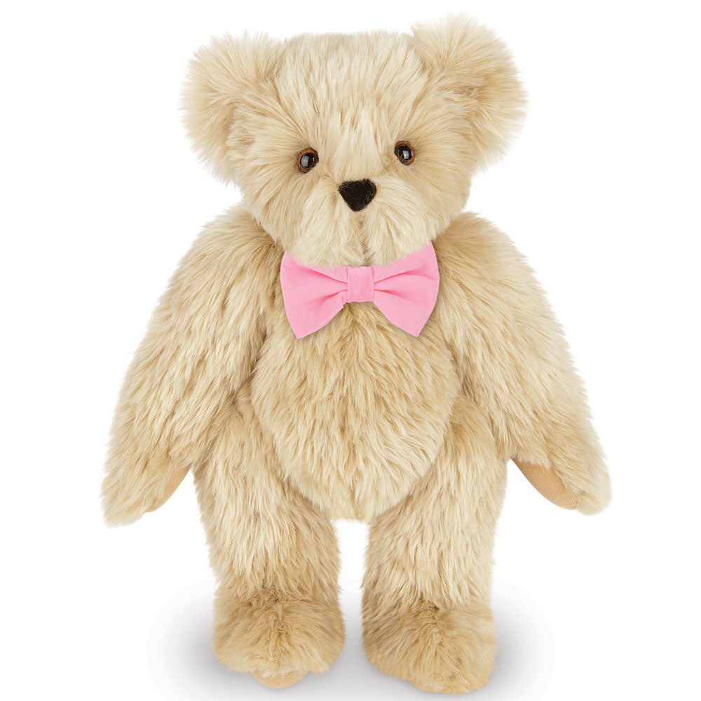 15-inch light beige plush teddy bear with a pink bow tie and soft fur.