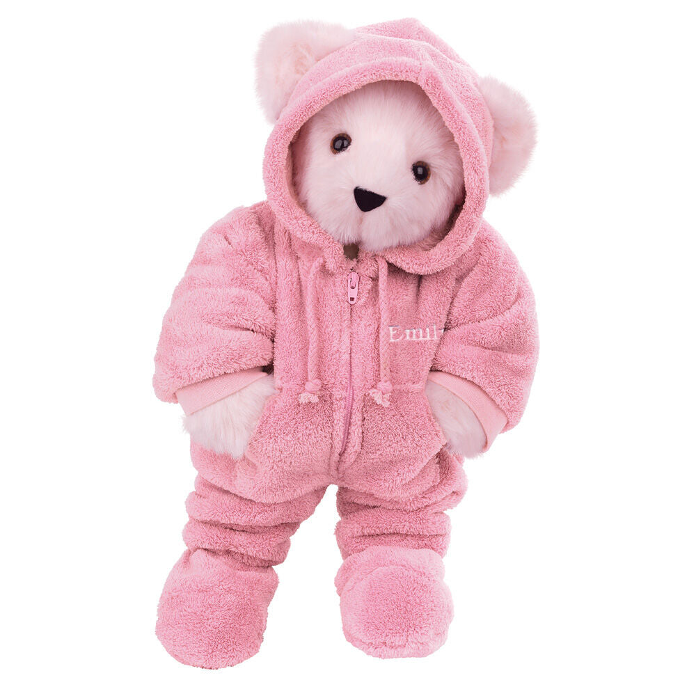Small teddy bear wearing a soft pink hooded footie with bear ears and mittens.