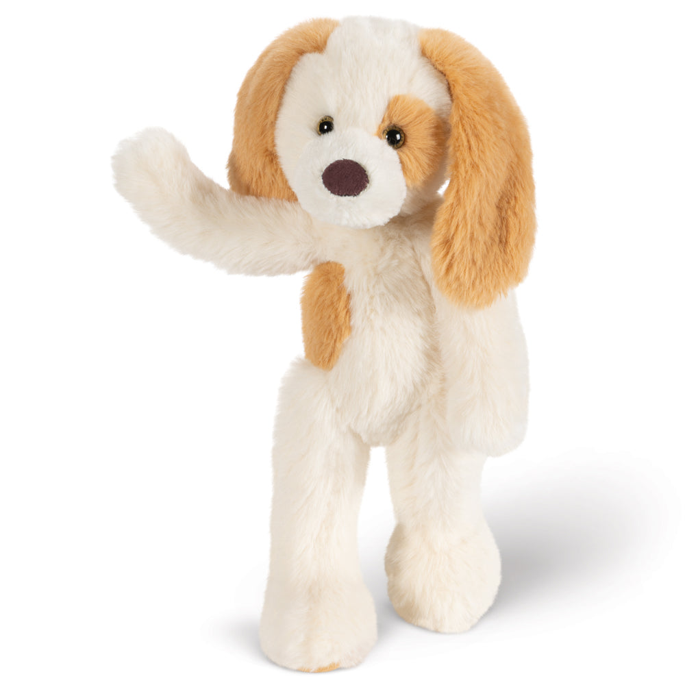A plush dog toy standing on two legs with one paw raised, featuring cream white fur, tan floppy ears, and a dark brown nose on a clean white background.