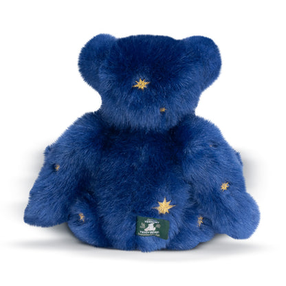 15-inch plush bear in deep blue fur with golden star embroidery and tag on front.