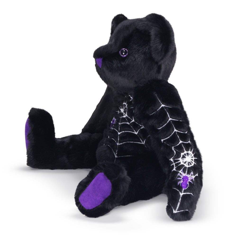 Aide view of Halloween teddy bear with spider web and purple accents on a white background