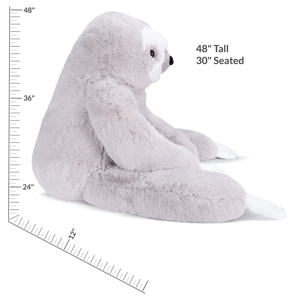 Plush large stuffed sloth with measurements on a white background