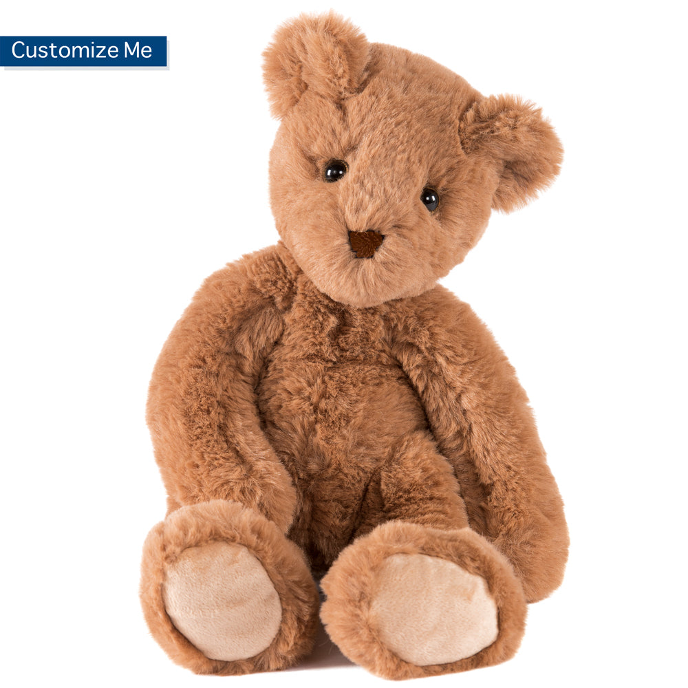 Soft brown plush teddy bear with stitched black eyes and nose, sitting upright.