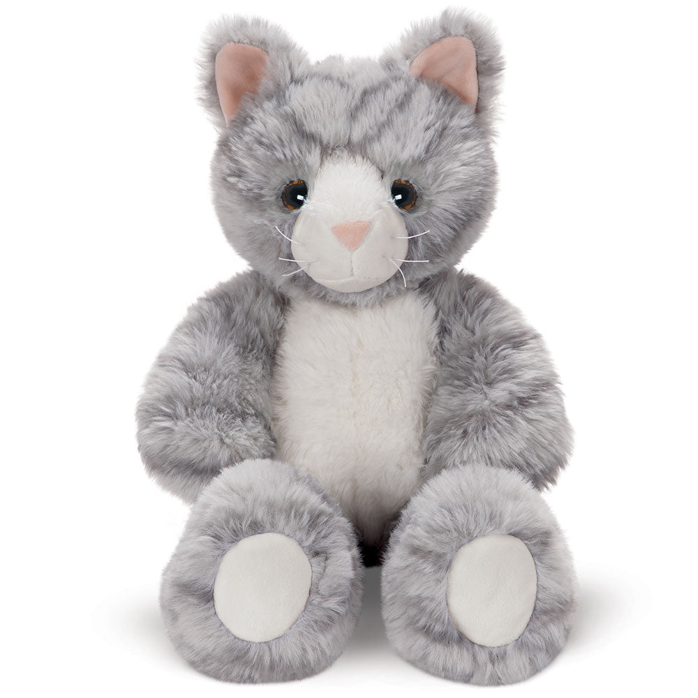 Gray and white plush kitten with soft fur and pink-lined ears sitting upright.