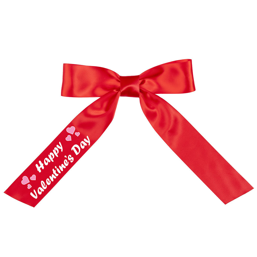 Red satin bow with long tails, one tail printed with "Happy Valentine’s Day" and small hearts.