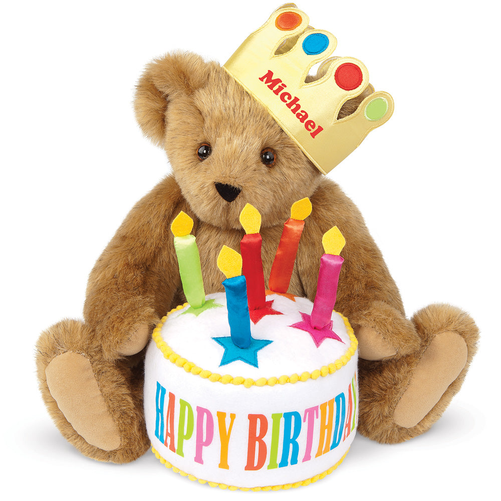 Honey brown plush bear wearing a personalized gold crown, holding a colorful birthday cake with star candles and "Happy.
