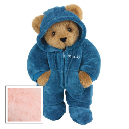 Honey-colored teddy bear wearing a blue hooded footie with embroidered name and paw pockets.